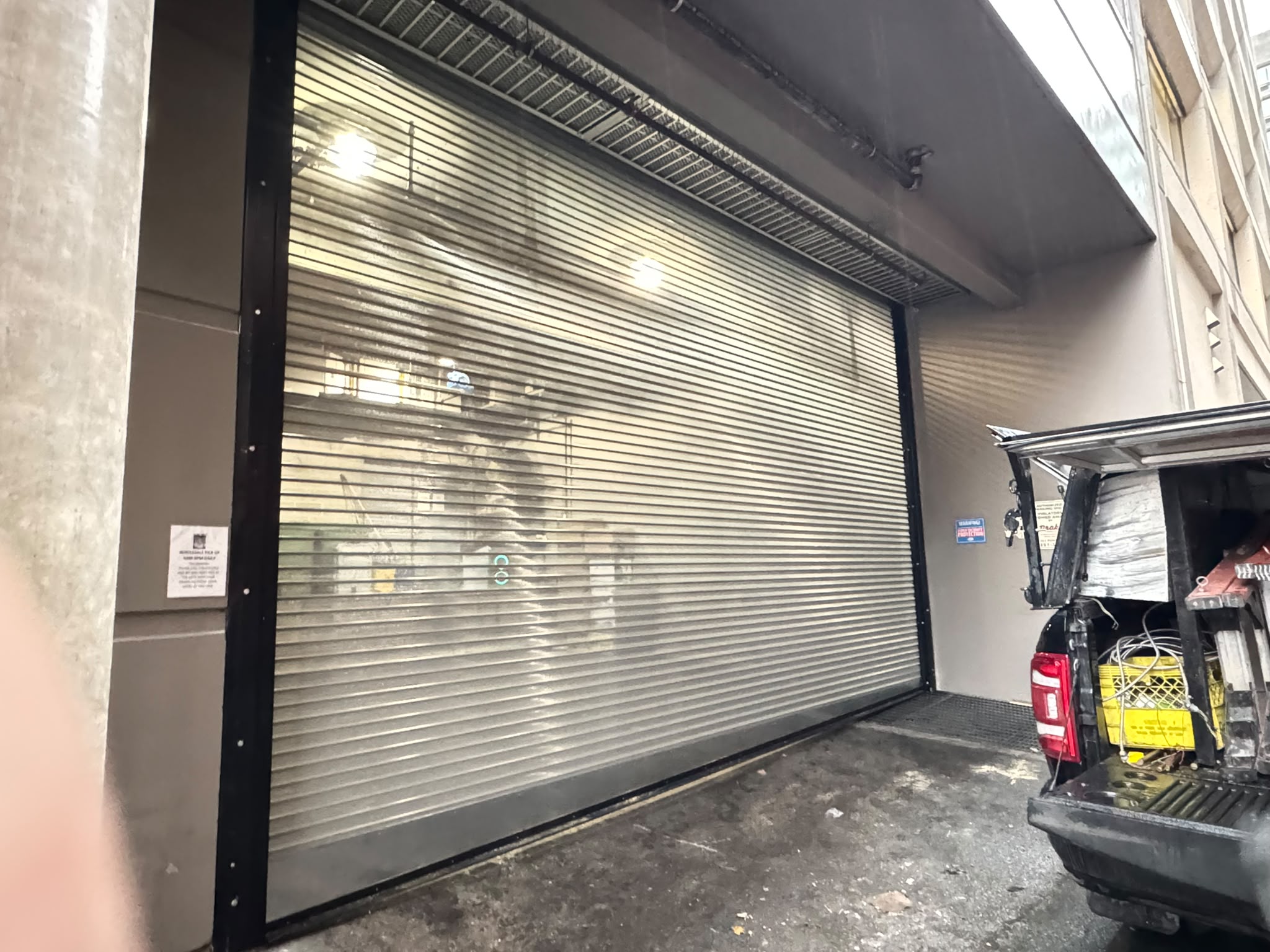 Rolling steel security shutter in a downtown loading bay